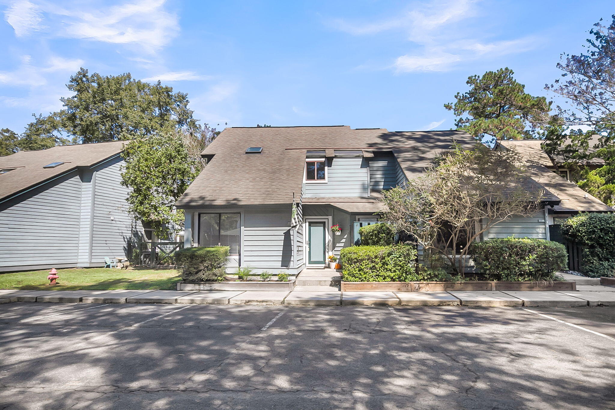 Discover the charm of 1138 Shadow Lake Circle, a spacious 3-bedroom, 3-bath condominium nestled in the desirable Snee Farm Lakes community of Mount Pleasant. Offering 1,812 square feet of well-appointed living space, this residence features an open-concept layout that seamlessly connects the living and dining areas to a generous eat-in kitchen''perfect for entertaining or everyday comfort. The downstairs bedroom and each upstairs bedroom include en suite bath, providing convenience and privacy for residents and guests alike. The interior has been thoughtfully renovated with the removal of popcorn ceilings, freshly painted kitchen cabinetry, new carpet on all carpeted spacesupstairs, and a full repaint of all interior surfaces. creating a bright, sunny, and inviting atmosphere throughout. For Buyers looking to offload yard and exterior maintenance by downsizing, this unit offers a still spacious interior choice.  Step out to the rear screened porch and enjoy tranquil views of the pond, ideal for relaxing mornings or peaceful evenings. Located just minutes from Mount Pleasant Towne Centre and with easy access to Isle of Palms via the connector, this home combines serene surroundings with unbeatable proximity to historic plantation homes, shopping, dining, and the beach.