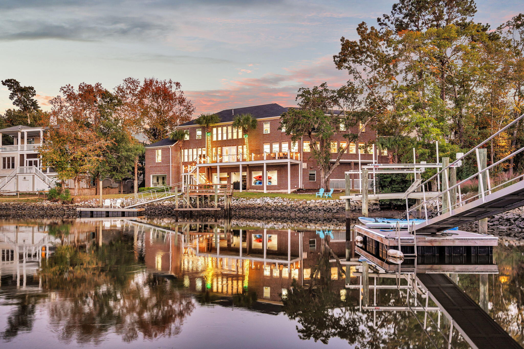 This magnificent 7,000-square-foot custom estate in Park West truly has it all--an exceptional location, breathtaking views, and every luxury imaginable. From the moment you step inside this stunning all-brick residence, you're greeted by soaring two-story windows that frame sweeping vistas of the tranquil marsh and shimmering water beyond. The elegant formal living room offers an inviting space for grand entertaining, with enough room in the foyer for a baby grand piano. Nearby, the formal dining room is enhanced by a beautifully detailed coffered ceiling, setting the tone for refined gatherings.The gourmet kitchen is a chef's dream, expertly designed to maximize the home's water views while flowing seamlessly into the spacious family room and a secondary dining area. Asthis was the builder's personal custom home, no expense was spared in crafting a space of unparalleled quality. The kitchen features a full Sub-Zero refrigerator and a full Sub-Zero freezer, a Viking gas cooktop and oven, granite countertops, a large central island, and dual pull-out drawer dishwashers. Off the kitchen, you'll find a well-appointed pantry and a convenient laundry room with a Miele washer and dryer, both of which convey with the home.

Every detail speaks of craftsmanship and sophisticationfrom the textured faux-stucco walls to the African hardwood floors that grace much of the main level. There's also an elevator shaft ready for installation, adding future convenience.

The primary suite on the main floor is a true sanctuary, featuring a cozy gas-log fireplace, a private sitting area, and elegant dual ceiling fans that lend a resort-like ambiance. The adjoining spa-inspired bathroom is simply spectacular, boasting bamboo flooring, Travertine stone finishes, an expansive walk-in shower, and a Jacuzzi whirlpool tub with a cascading waterfall feature. The custom walk-in closet is practically a room of its own, with built-in shoe cubbies, drawers, and glass-front cabinets for impeccable organization.

Upstairs, you'll find four spacious bedrooms, including a second master suite ideal for guests, as well as a fifth flexible room perfect for a study or home office. Two of the bedrooms share a charming featurea built-in aquarium that glows softly at night, creating a magical touch for children's rooms. There's also an unfinished bonus space, ideal for conversion into a future media or game room.

The ground level offers even more versatility, with a large secondary living area, a home gym, and an adjoining room already plumbed for a steam shower. The two-car garage provides ample storage and workspace.

Yet, it's the outdoor living area that truly sets this home apart. Step outside to find a spectacular covered lounge and dining space overlooking the marsh, complete with a granite-topped bar, beverage refrigerator, and a full bathdesigned to accompany a future pool (plans available with the sale). Just steps from the home, a sprawling deck stretches the width of the property, leading to a floating bulkhead perfect for crabbing, fishing, or launching your boat. As the day winds down, relax with a glass of wine and watch dolphins play in the sparkling watersa fitting end to life in this extraordinary Lowcountry retreat.