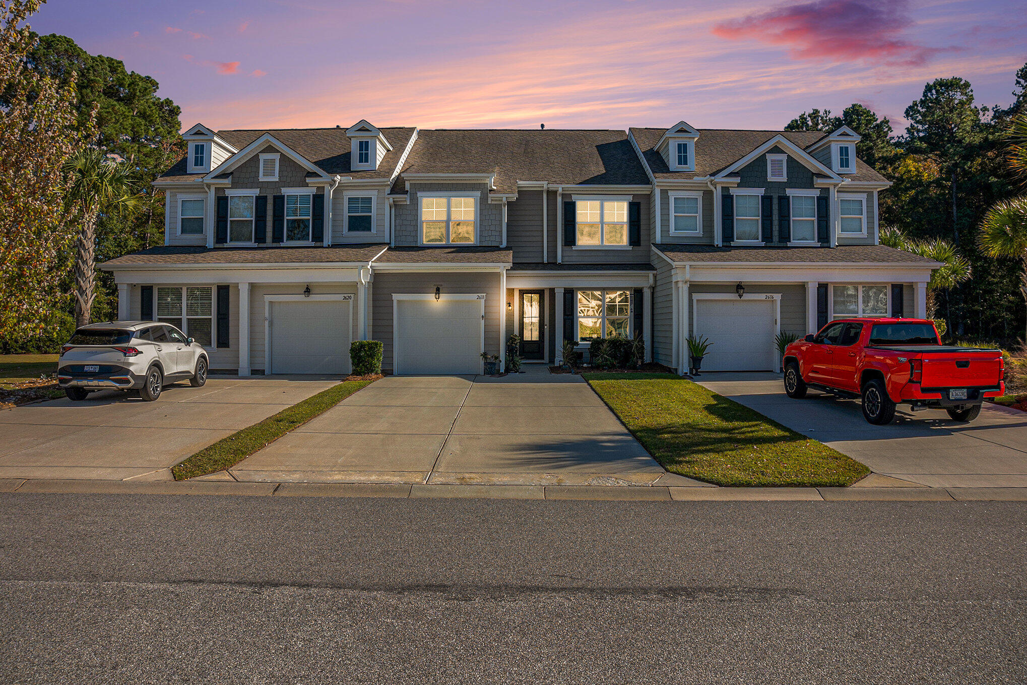 Discover elevated Lowcountry living in this luxury townhouse located in the desirable Park West community. This beautifully maintained home offers four spacious bedrooms plus a versatile loft, a one-car garage, and a screened-in porch overlooking a tranquil pond wrapped in lush woods providing unmatched privacy and serene views from multiple rooms throughout the home.Upon entering, a formal dining room sits to the right, perfectly suited as an office or playroom. A hallway leads to a half bath and the laundry room before opening into the stunning chef's kitchen. The kitchen features a large island, granite countertops, upgraded cabinetry with crown molding, a pantry, and stainless-steel appliances including a gas range.The kitchen flows seamlessly into the family room, which opens to the screened-in porch, the ideal place to enjoy peaceful mornings and evenings surrounded by nature. From both the screened porch and the primary bedroom, you can take in the beautiful pond views and wooded privacy. Frequent wildlife visitors include deer, turkey, egrets, herons, and more. At night, landscape lighting creates a cozy ambiance perfect for unwinding outdoors.The owner's suite is conveniently located on the main level, offering not only gorgeous water and wooded views but also a spacious bathroom and a generous walk-in closet with custom built-in shoe storage that lifts to reveal additional hidden space.Upstairs, the large loft offers endless flexibility perfect for a media room, second living space, office, or playroom. Three spacious bedrooms surround the loft, two of which include walk-in closets. A large linen closet provides additional storage. This home offers ample storage throughout, including a second pantry under the stairs.Additional features include wood flooring throughout the first floor, tile in all bathrooms and the laundry room, upgraded baseboards and lighting, a tankless water heater, garage storage, and a gas line with a dedicated paved area for grilling.The outdoor space is truly exceptional, featuring beautifully curated landscaping that enhances the tranquil pond and wooded backdropcreating a private oasis enjoyed from the porch, primary bedroom, and backyard. The lot backs up to the Charleston County Park, offering privacy and one of the most desirable settings in Center Park South.Park West residents enjoy resort-style amenities including two pools, tennis courts, a clubhouse, miles of walking trails, and a golf-cart-friendly community. Within the neighborhood are Publix, restaurants, a gym, a recreation facility, and county park access. Conveniently located near Costco, Walmart, Roper Hospital, and the Wando Marina, this home offers both luxury and lifestyle in one perfect package.