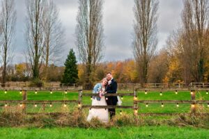 A wedding couple in the field at Lillibrooke Manor wedding venue