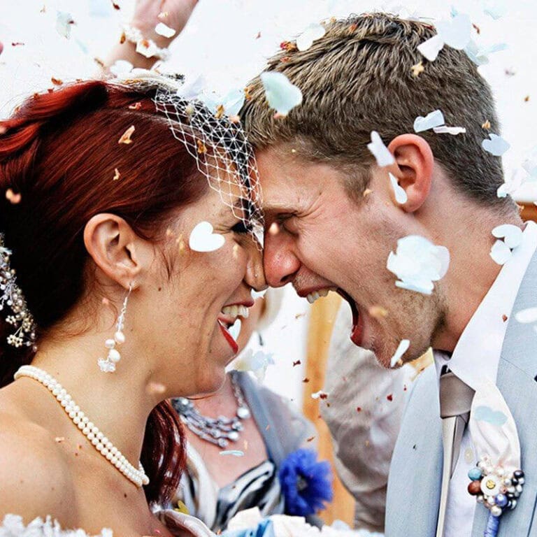 wedding couple celebrating with confetti