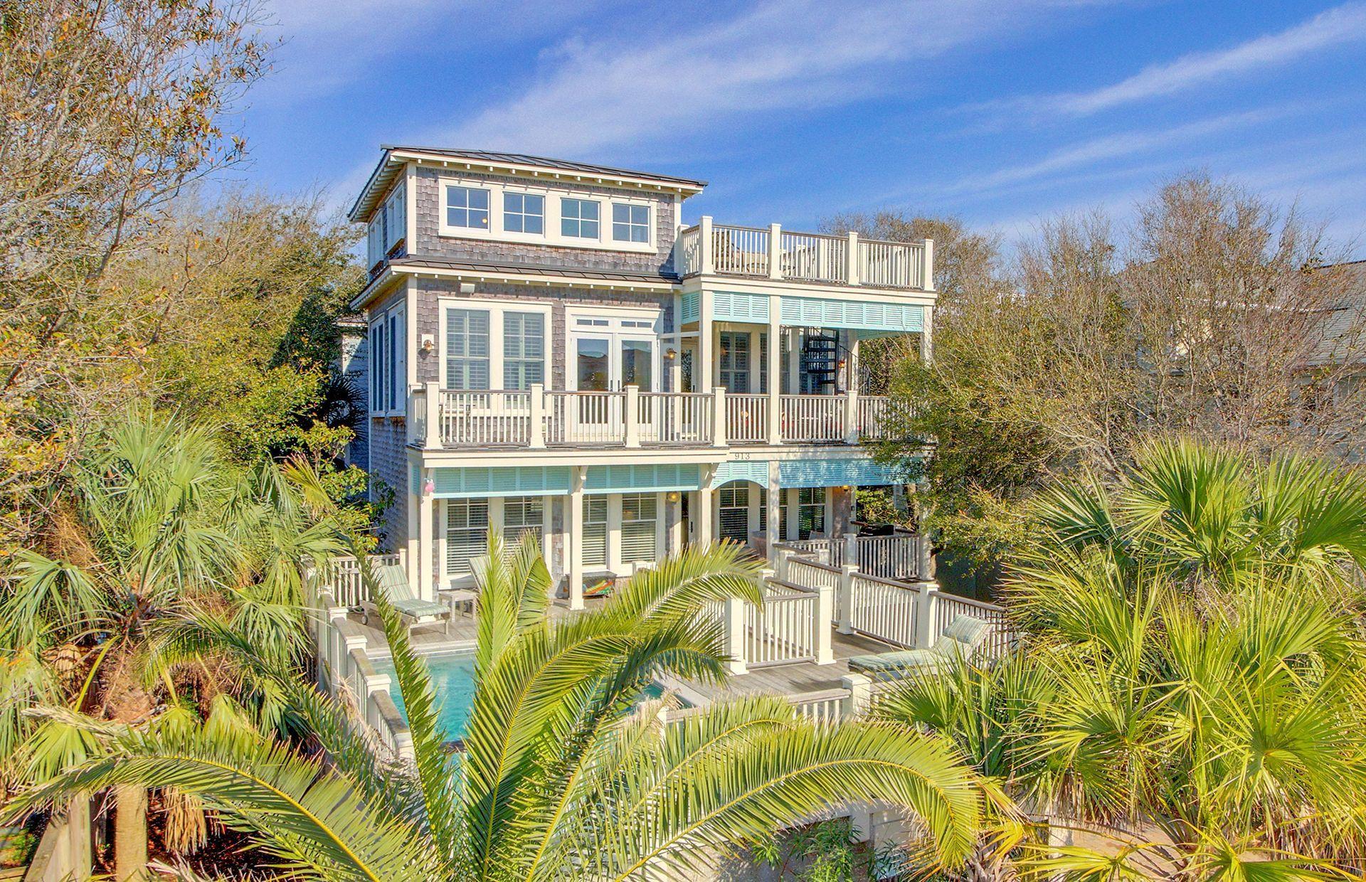 This home was built by Thomas Evans Construction, one of the island's finest builders. The home is well-maintained with many upgrades in 2022 and 2023. Currently a super performer on a vacation rental program, It would also make a great primary or second home. This one has all the bells & whistles including an elevator to all three floors, an elevated pool, and ocean views from the roof deck. No expense was spared in the custom bead-board and V-groove paneling, plus plantation shutters. The great room has dramatic high ceilings, clerestory windows and a fireplace flanked by custom built-ins. You will love the open reverse floor plan with the living areas on the top floor. High end finishes include cherry hardwood floors, maple cabinetry, tile and natural stone. Please clickThe kitchen is state-of-the-art with black granite counters, separate wine refrigerator, and stand-alone ice maker. There is island seating and the dining room features a long farm table to seat a crowd. There is a walk-in pantry and a powder room nearby. There is one master bedroom on the main/top level, as well as an office currently used as bedroom #7. A covered porch on this level has spiral stairs leading to an ocean view roof top deck.

Down one level is a second master bedroom and another deluxe master bath.  This level has two rear bedrooms with a shared bath between them.  One is furnished with a king size bed and the other has a queen bed. A "bunk" bedroom that sleeps four, the front queen bedroom, laundry room and a hall bath complete the middle level.

The elevated pool is accessed from the middle level of the home.  There is a large sundeck surrounding the pool as well as a covered porch for those who prefer the shade.

The ground level (which meets the required minimum elevation for flood insurance) has a large game room, a wet bar and a full bathroom. There is also a very large owner's storage room located on this ground level. A rear patio off the game room and a two car garage complete the ground level.

The lot is beautifully landscaped and there is a lawn irrigation system.  There is a handsome paver driveway with guest parking spaces. The rental permit allows 14 guests and 6 cars.

While located on a quiet residential block, the commercial area is within easy walking distance.  Whether you are looking for fine dining or pizza, you never need to get in your car. The beach access path at 10th Avenue is one short block from this home. Historic downtown Charleston is minutes away and the airport is also convenient. The Isle of Palms has a recreation center with tennis courts, ball fields, even a dog park.