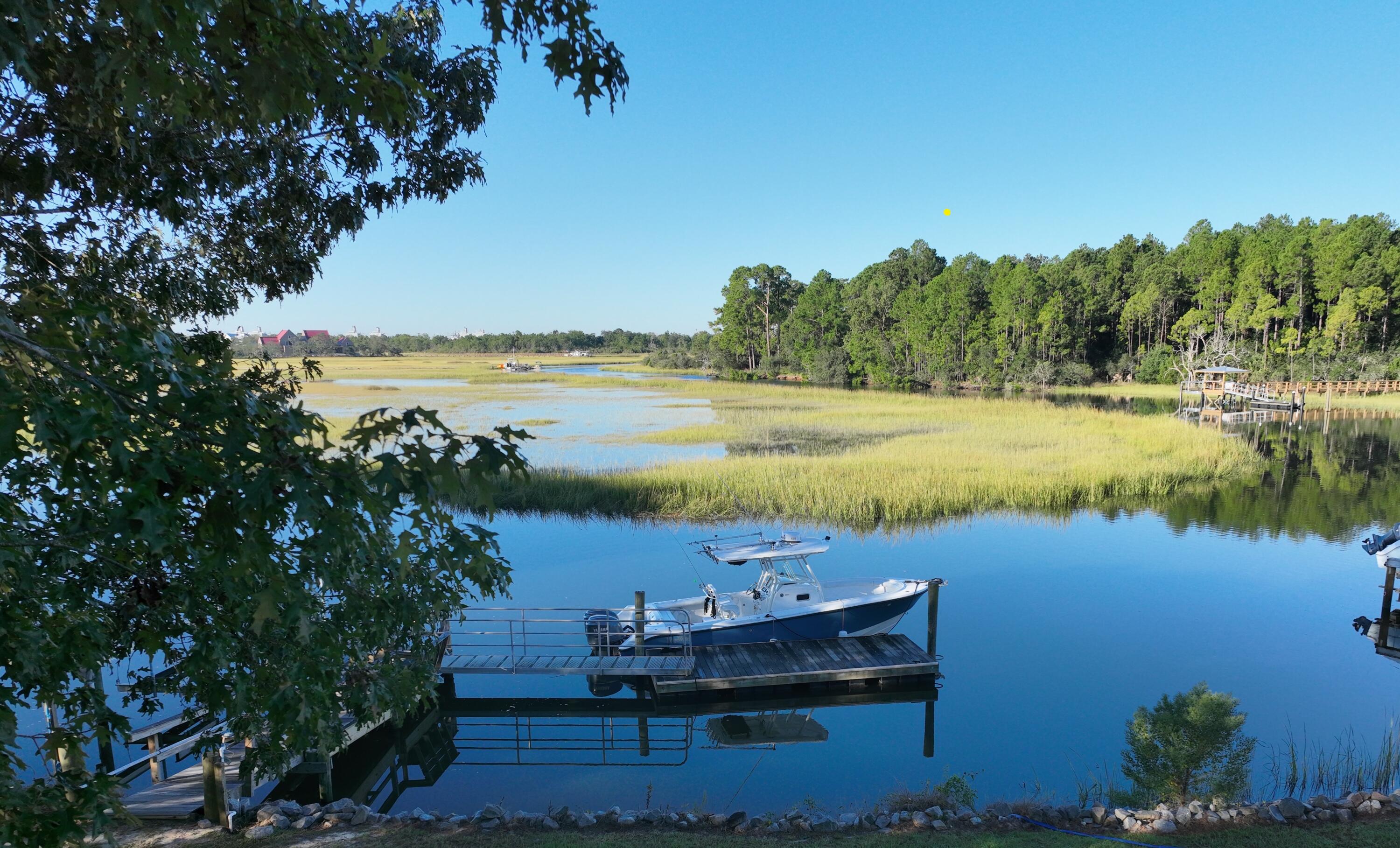 The lowcountry lifestyle is what we are all looking for -over an acre of uninterrupted views of Beresford Creek water and marshes, privacy, a short boat ride to the Cooper River, the best Charleston fishing and a fabulous location right off of Daniel Island proper. This newly renovated Project House by Maverick Construction and Embellish Interiors is a once in a lifetime opportunity to own a stunning ''new'' home on and incredible deep water lot. The fabulous home features a new salt water pool, a private short true deep water dock with a boat lift and floater. A coveted location for Daniel Island boaters - the infamous bend in Beresford Creek is perfect for fishing and a convenient location - close to Daniel Island, the airport, downtown and Charleston beaches. From the moment you enterfrom the full front porch, you will fall in love with the breathtaking panoramic creek and marsh views. The main floor features a stunning new open kitchen and dining area design with endless, thoughtful features including all new custom cabinetry, appliances and a beautiful scullery with a wine refrigerator and ample storage. The expansive living room has French doors that open to the screened porch overlooking the new pool, creek and expansive yard. The primary suite is on the main floor with a luxurious spa bath and custom closets - also with to-die-for views. A private office with retractable glass doors, custom built-ins and Maverick's signature beamed ceiling, as well as a half bath are on the main floor. 

The second floor has four additional bedrooms and three full newly redesigned bathrooms and a laundry room. Custom wall sconces, shiplap, wood details and classic railings give endless designer details at every turn. 

The three bay garage has ample parking, storage, and a newly air conditioned pool house with full bath and generator. An elevator is accessible from all three floors. 

Outside, the new salt water pool overlooks the panoramic deep water views. The dock is 35 ft dock with water and electric, 18 ft gangway, 20 foot floating dock for two boats and a 14,000 lb boat lift with new motors. Getting your boat out of the water has never been easier with the neighborhood shared boat ramp right next door.


BUYER IS RESPONSIBLE TO CONFIRM ANY INFORMATION IN THIS LISTING THAT IS IMPORTANT IN THE PURCHASE DECISION SUCH AS FEATURES, SQUARE FOOTAGE, LOT SIZE, MEMBERSHIPS, TAXES AND SCHOOLS.