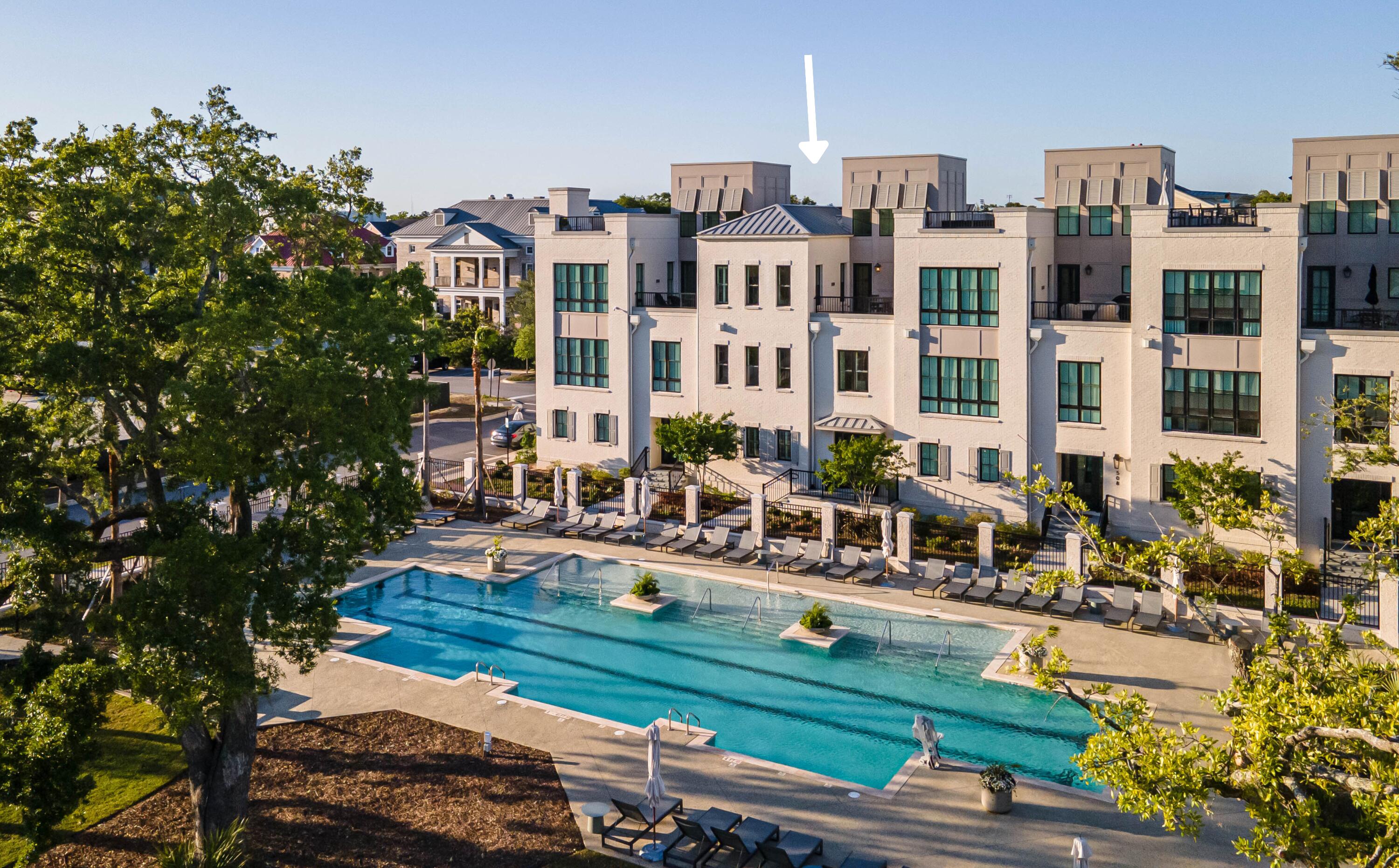 Lowcountry luxury awaits at 510 Helmsman Street, a 4 bed 3.5 bath townhome in the beautiful Waterfront area of Daniel Island. The interior of the townhome was designed by Cortney Bishop and offers stunning selections throughout the home; features include inset cabinetry, Bosch appliances, Circa lighting and fans, beautiful white oak floors, and more. The open floor plan allows you to stay engaged with your guests! Prep dinner in the gourmet kitchen while you have family seated at the island, in the living room, and the family room. Even dine al fresco on the terrace and take in the beautiful, private pool.The owner's suite dazzles with an eye-catching chandelier, dual closets, and a spacious en suite bath. Slip away and relax on the rooftop, with gorgeous views of the Wando River Bridge.

510 Helmsman offers an impressive list of upgrades. A first floor master bathroom, four-stop elevator, updated Circa lighting and ceiling fans, new hardwood floors in previously carpeted bedrooms, built-in custom closets, custom window coverings, epoxy flooring and organization system in the garage, and added a rooftop yoga space. 

First-class amenities include a private pool, fitness center, mail room, and a newly re-designed waterfront park. The home's prime location lends itself to an outdoor, active, and wonderfully convenient lifestyle. Homeowners take pleasure in walking the miles of trails hugging the Wando River, dining at some of Daniel Island's tastiest restaurants, and traveling just minutes to the grocery, medical professionals, local shops, and more. This is your chance to own an upgraded Waterfront condo! Schedule a showing today.
