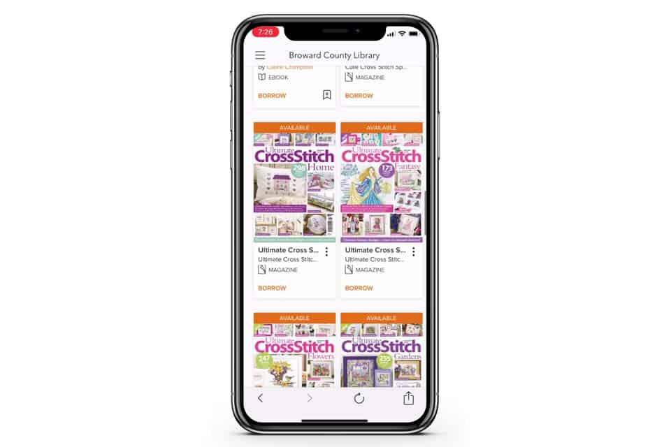 Phone screen with a shot of Broward County Library doing a Cross Stitch search showing magazine results