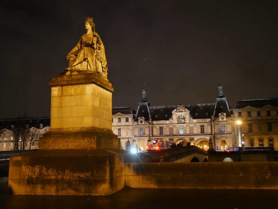 Female statue at the bridge outside Louvre Palace