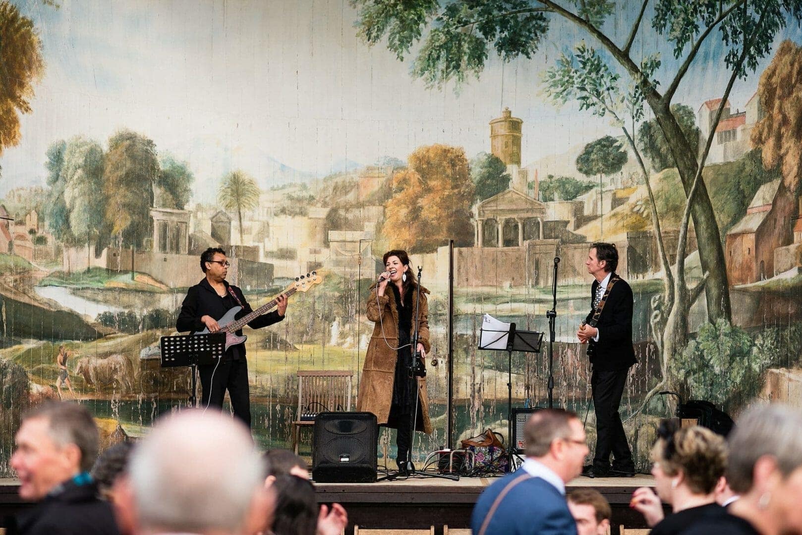 Band on stage at the Larmer tree gardens Wiltshire wedding