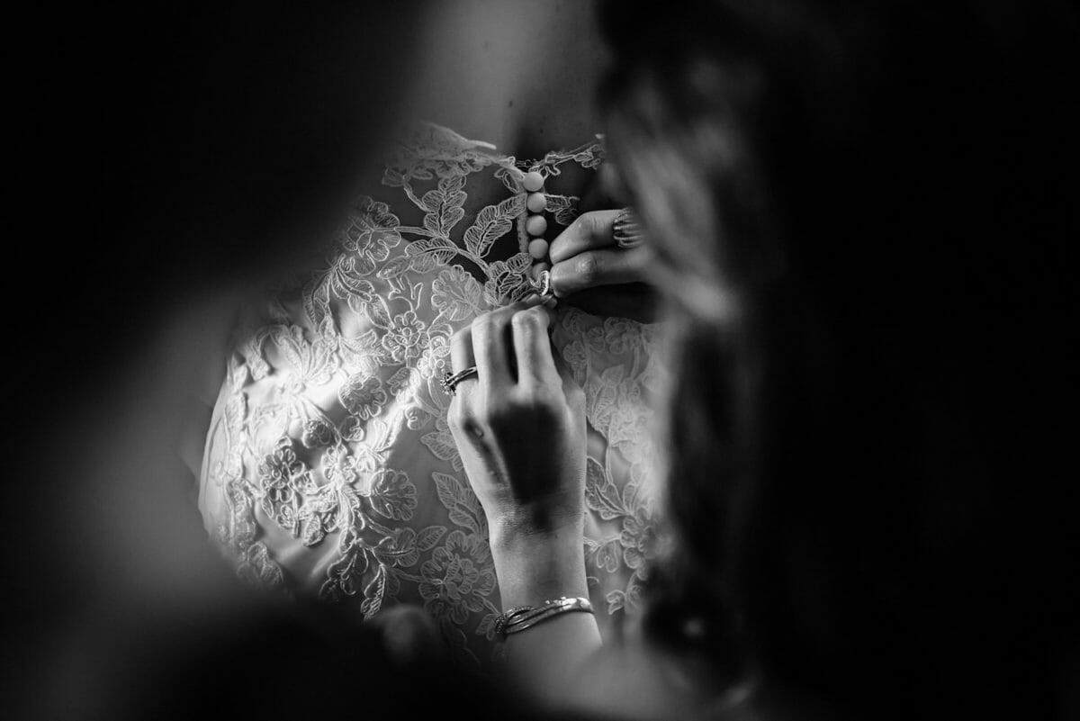 Fastening the wedding dress