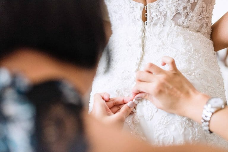 Putting on the wedding dress