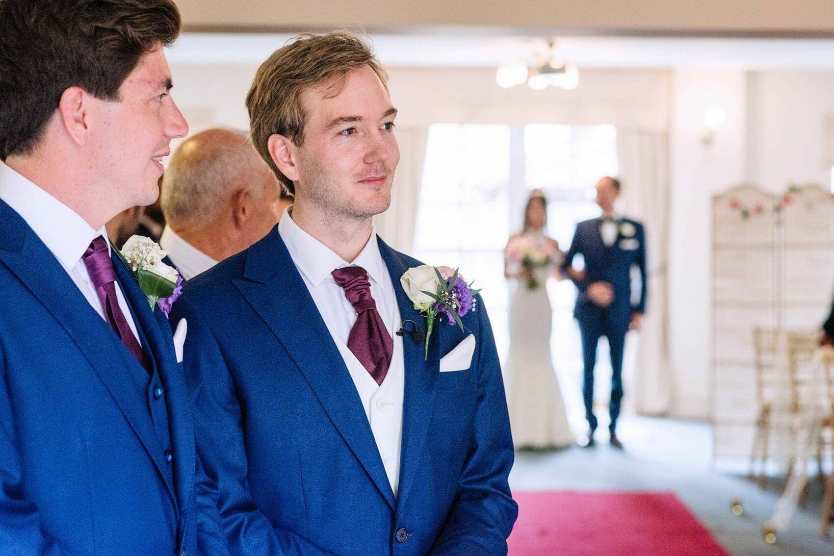 Groom waits for bride in the aisle at the Italian Villa in Poole, Dorset