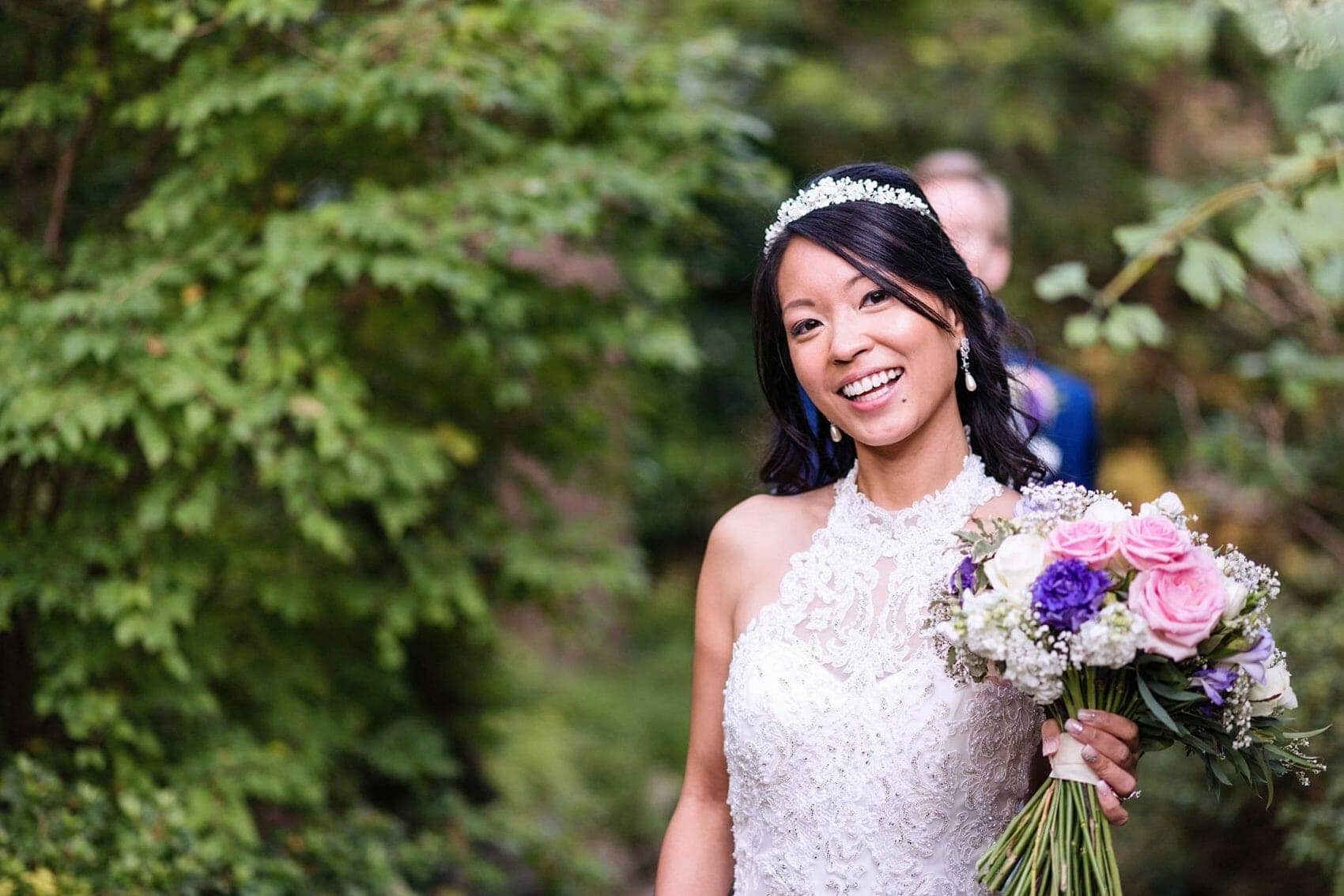 Bride in the gardens at Compton Acres