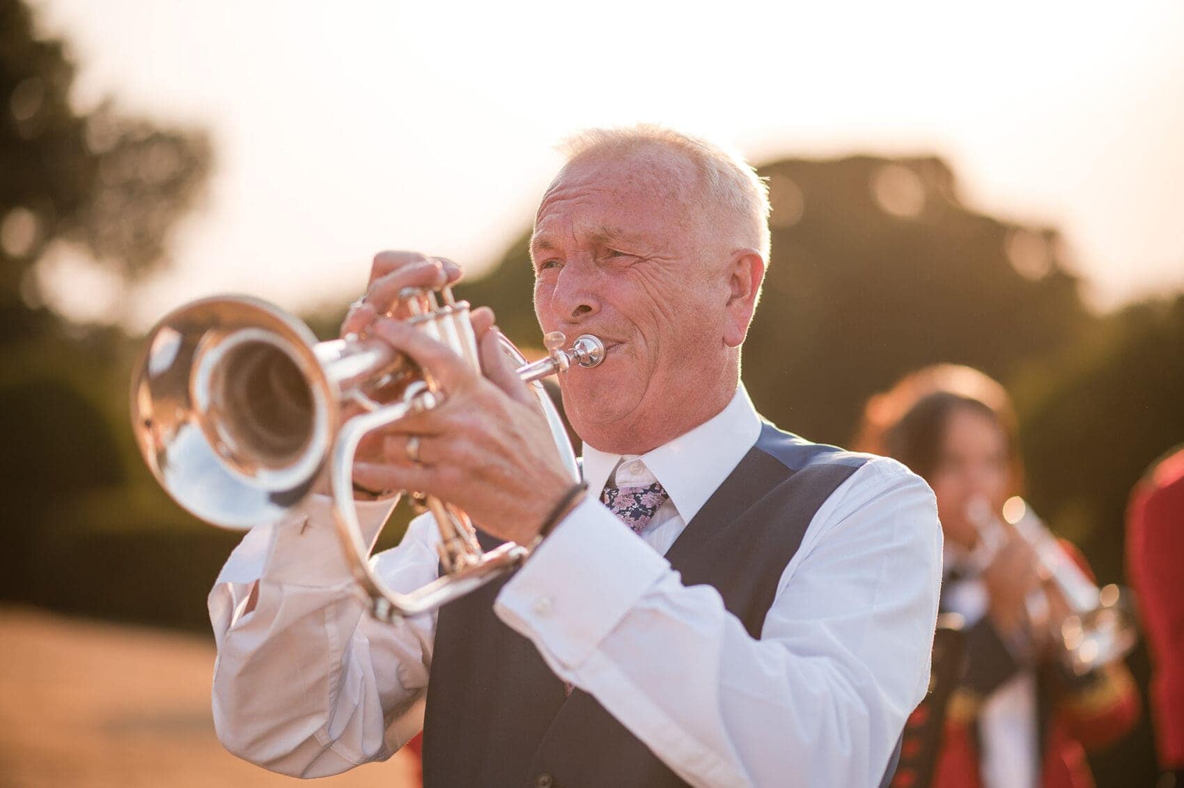 Father of the bride playing a trumpet at Hale Park