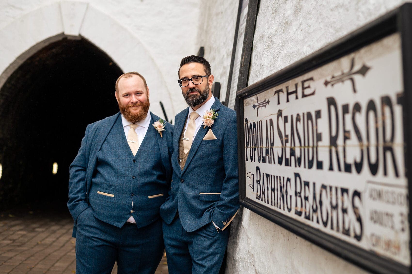 Tunnels Beaches Wedding - the Groom by the entrance sign