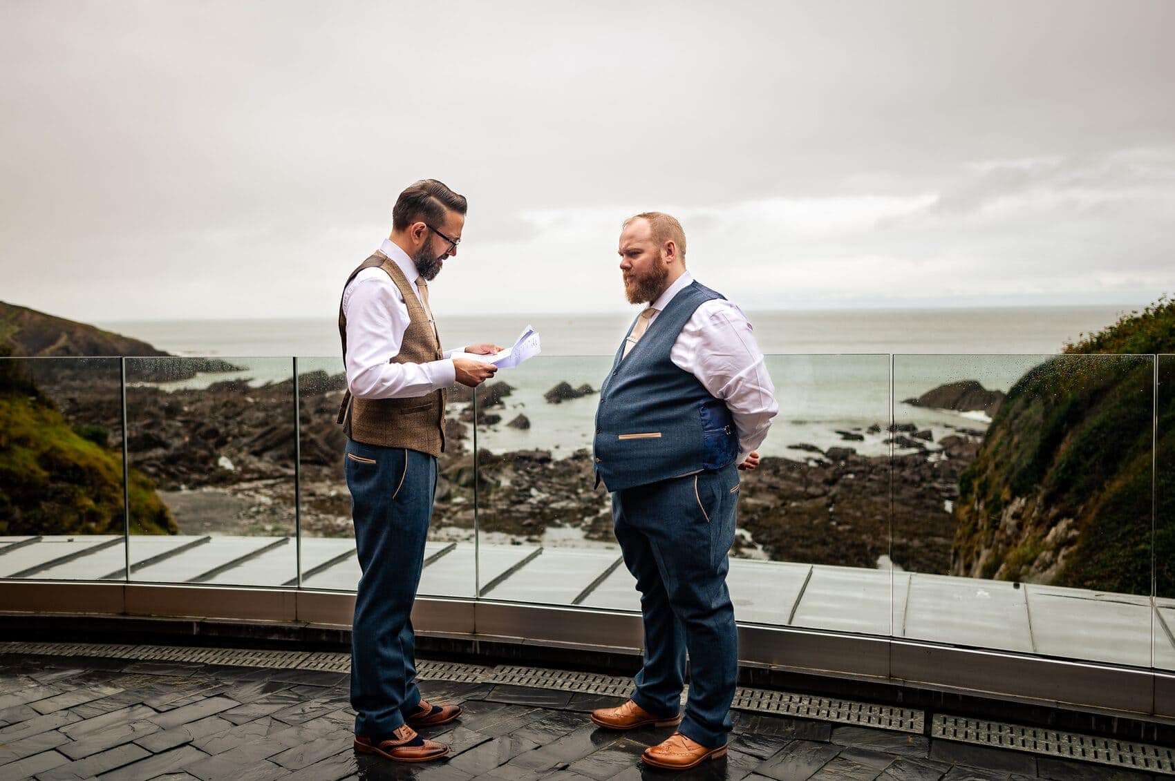 checking the speeches by the sea at Tunnels Beaches Wedding