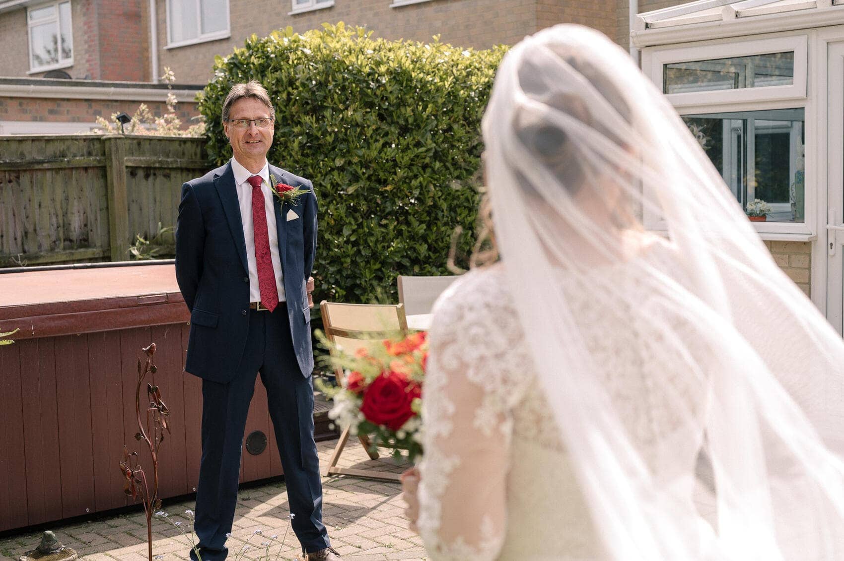 Father of the bride looks on at his daugheter