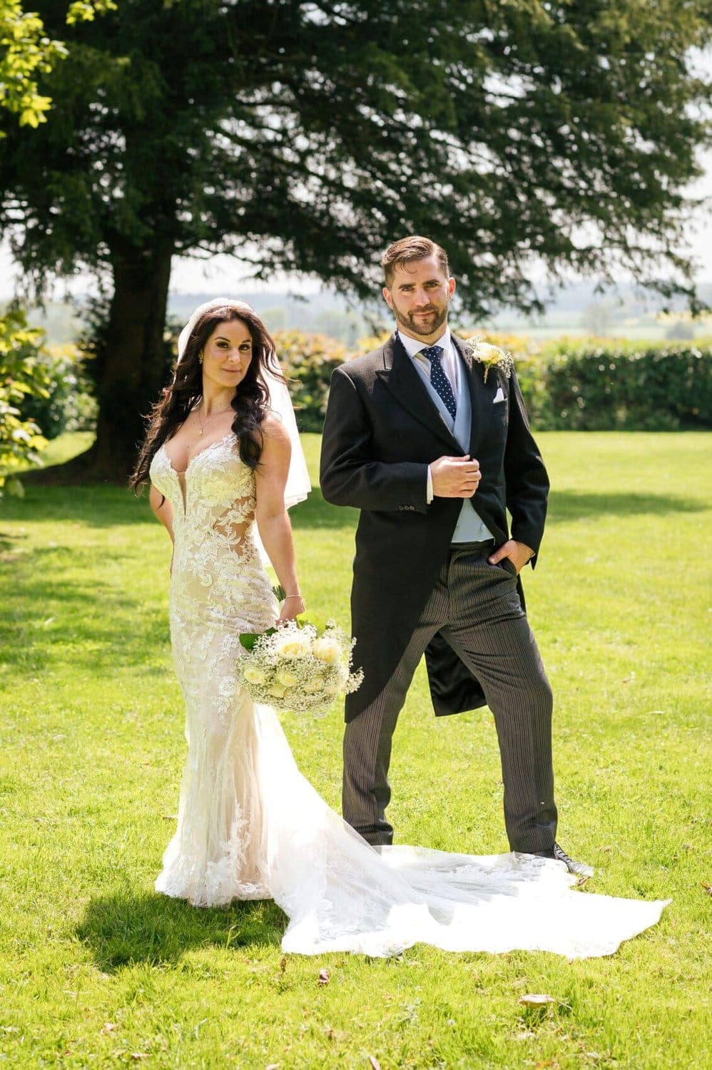 Bride and Groom pose at Abbots Court