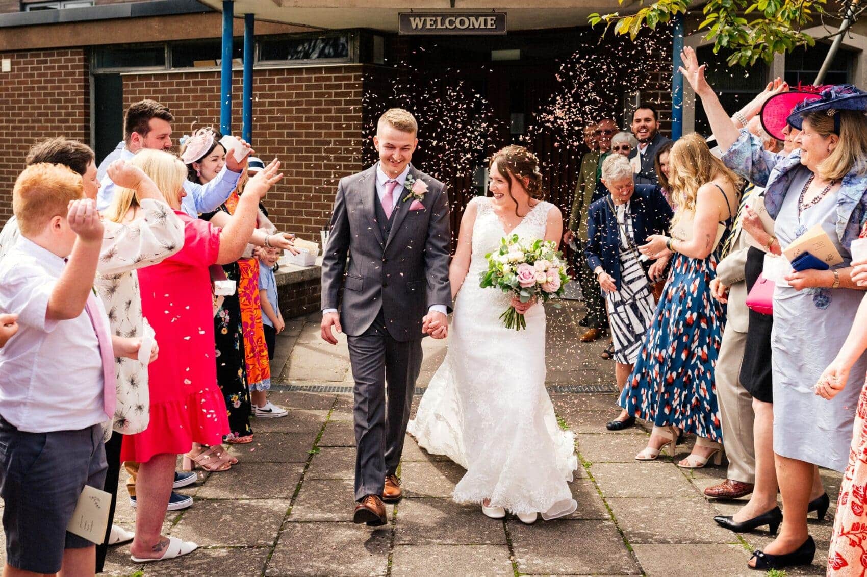 Confetting outside St Mary's Catholic Church wedding