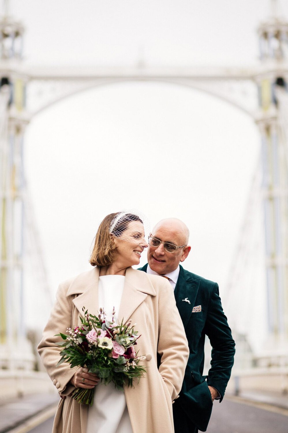 King Albert bridge in london behind the Bride and Groom