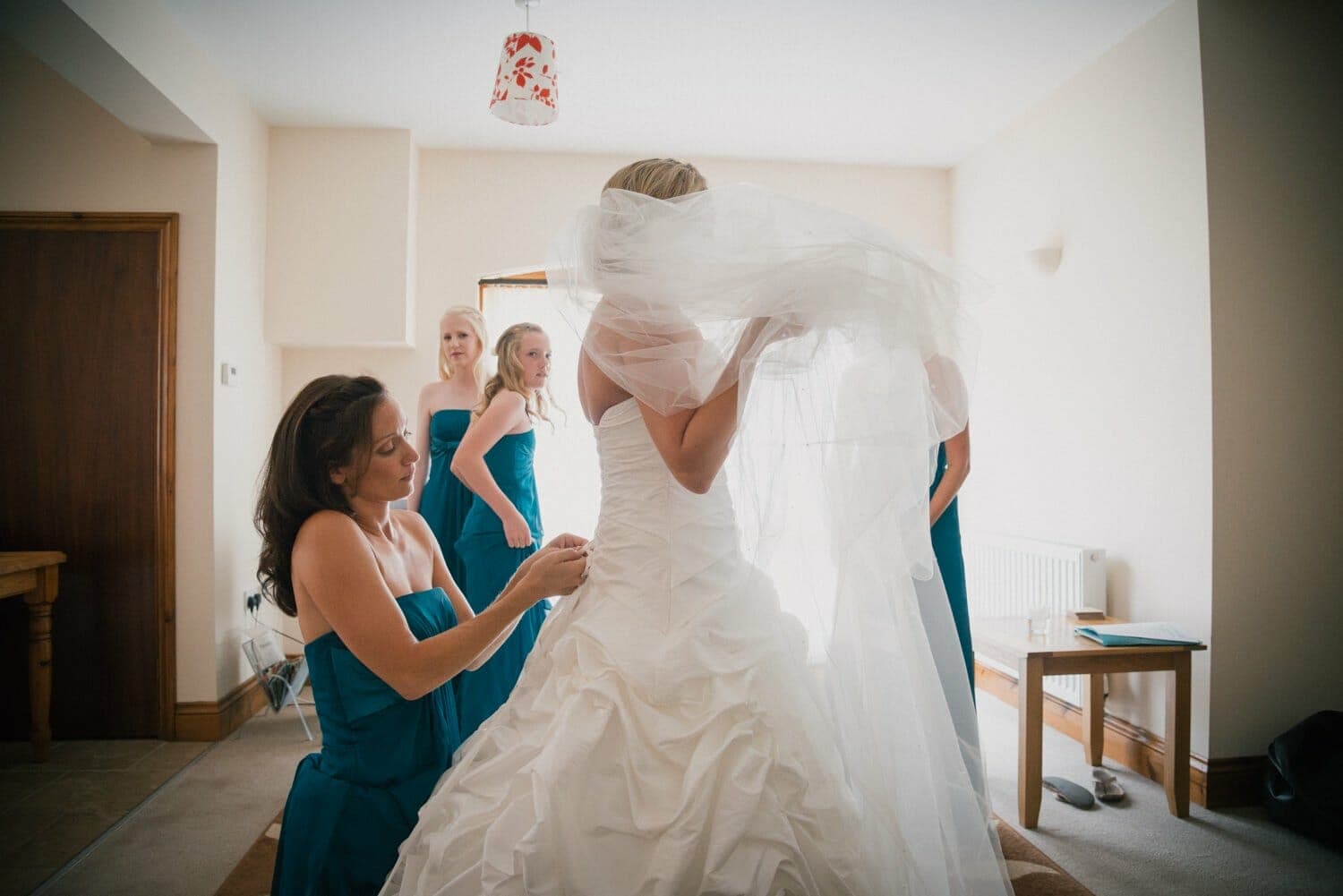 Bride dressing for Milton Abbey