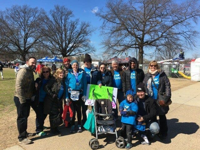 Author standing with 10 friends and family members after running the DC Rock ‘n’ Roll Marathon