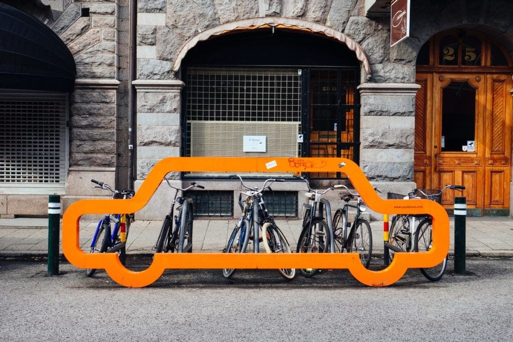 car outline in front of bicycles