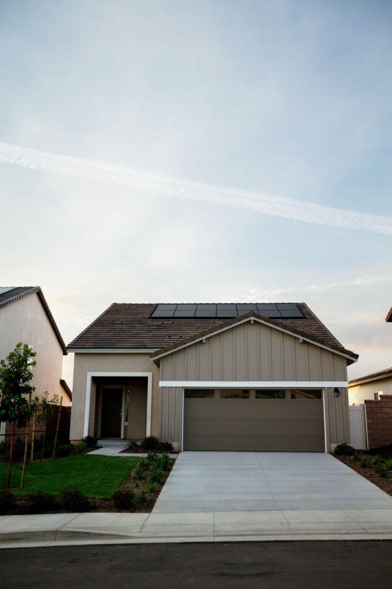 eco-friendly home with solar panels on roof