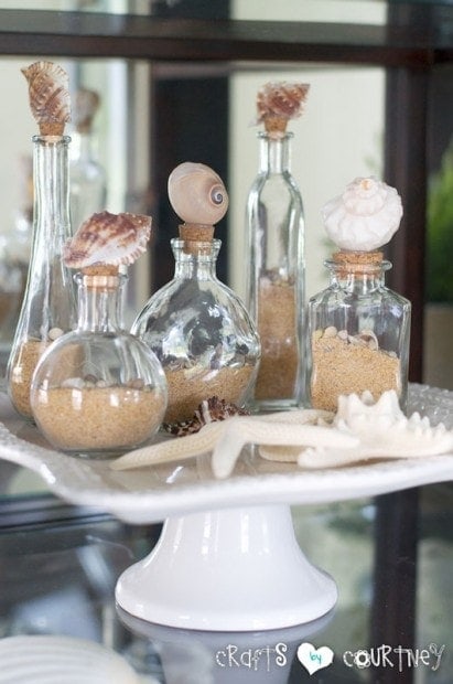 coastal bottles filled with sand and shells