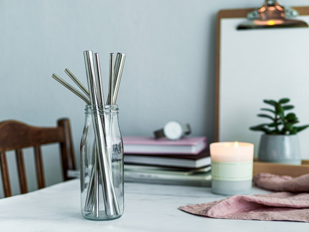 stainless steel reusable straws in glass jar