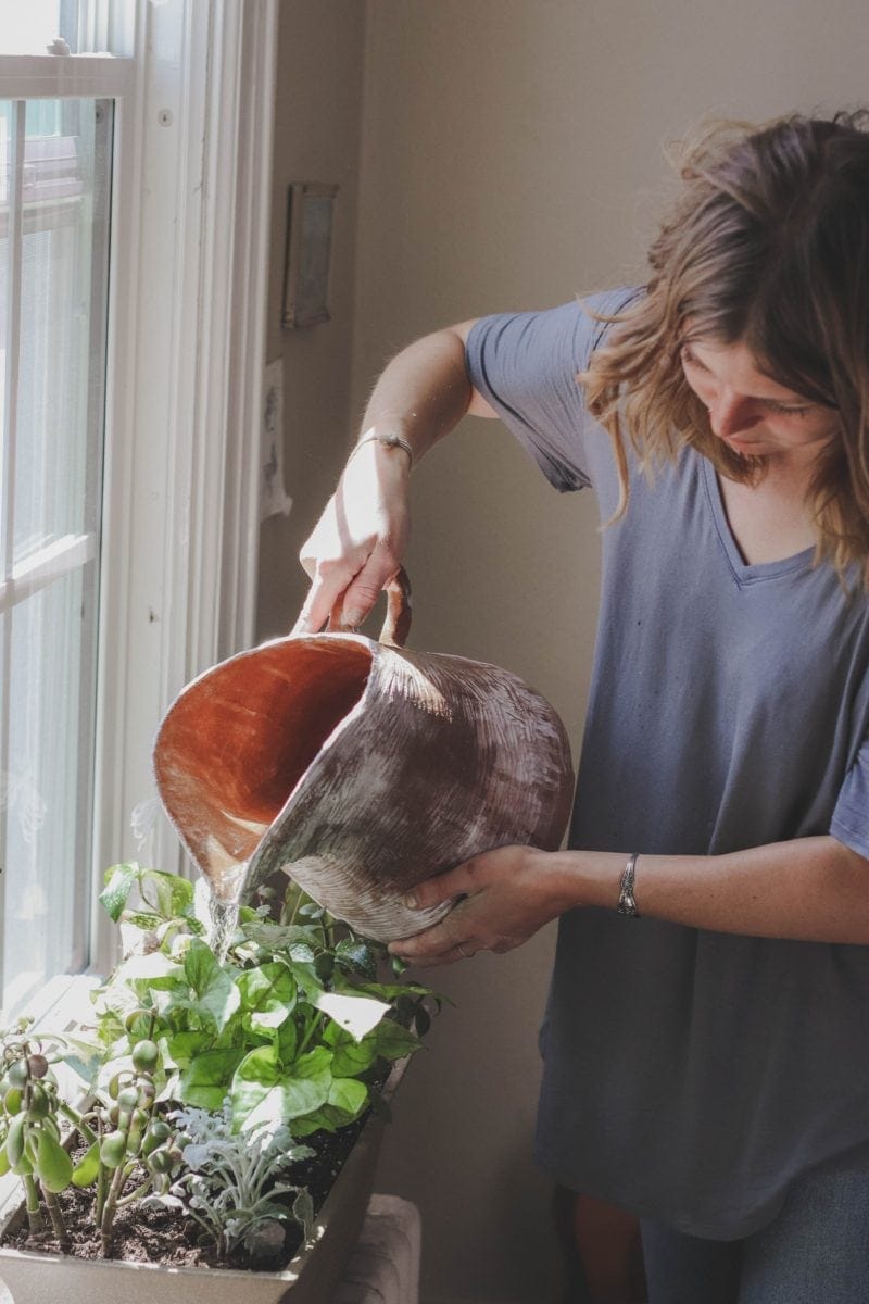 woman watering plants 