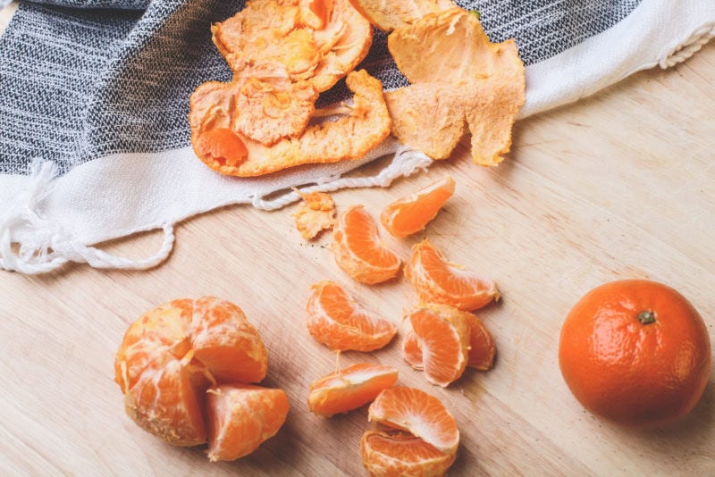 orange and peels on kitchen counter