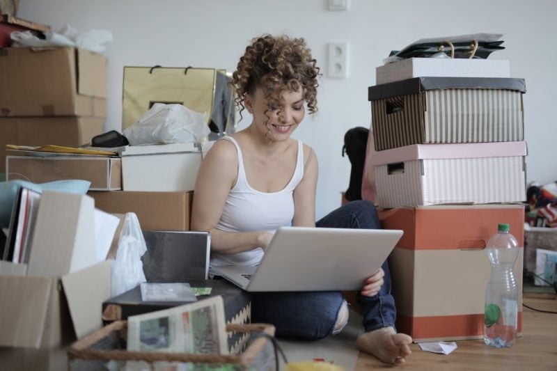 woman shopaholic with boxes from online shopping