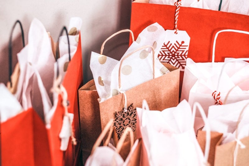 red and brown paper gift bags with tissue paper