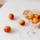 fruit in reusable grocery bag on table