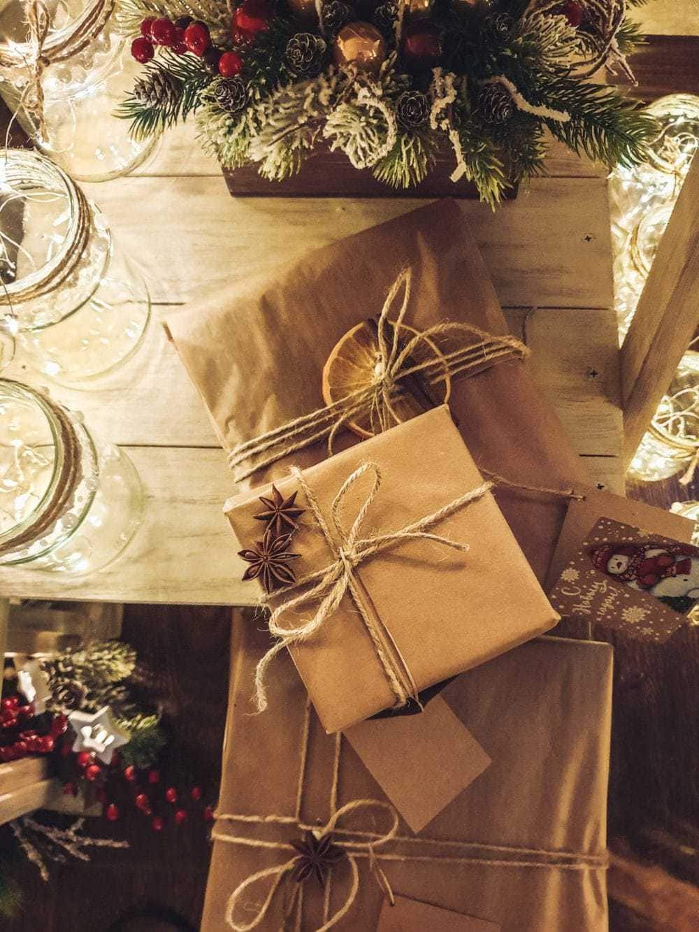 sustainably wrapped gift with brown paper, twine, citrus and cinnamon