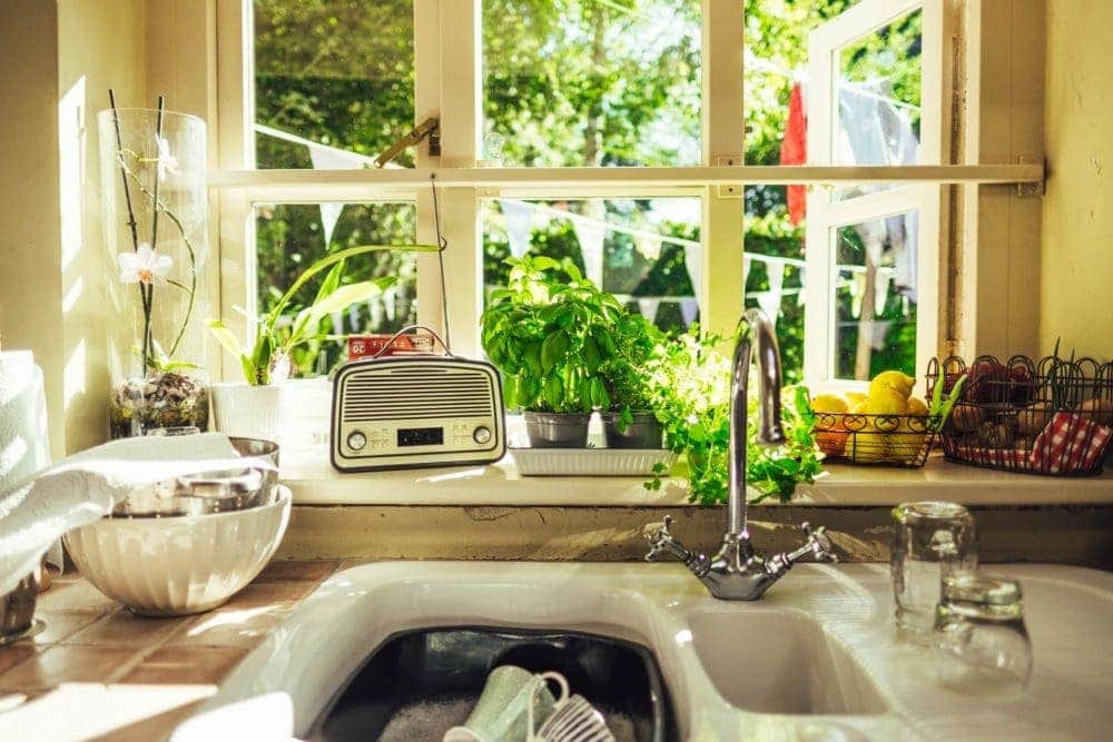 kitchen sink with dishes soaking in water