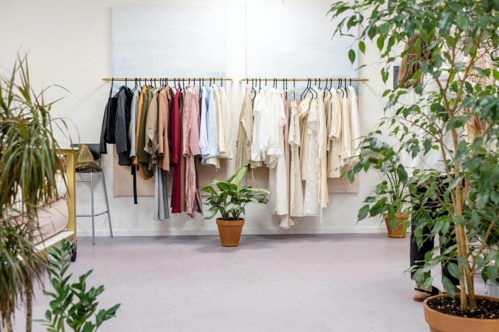 clothing on rack in secondhand clothing store