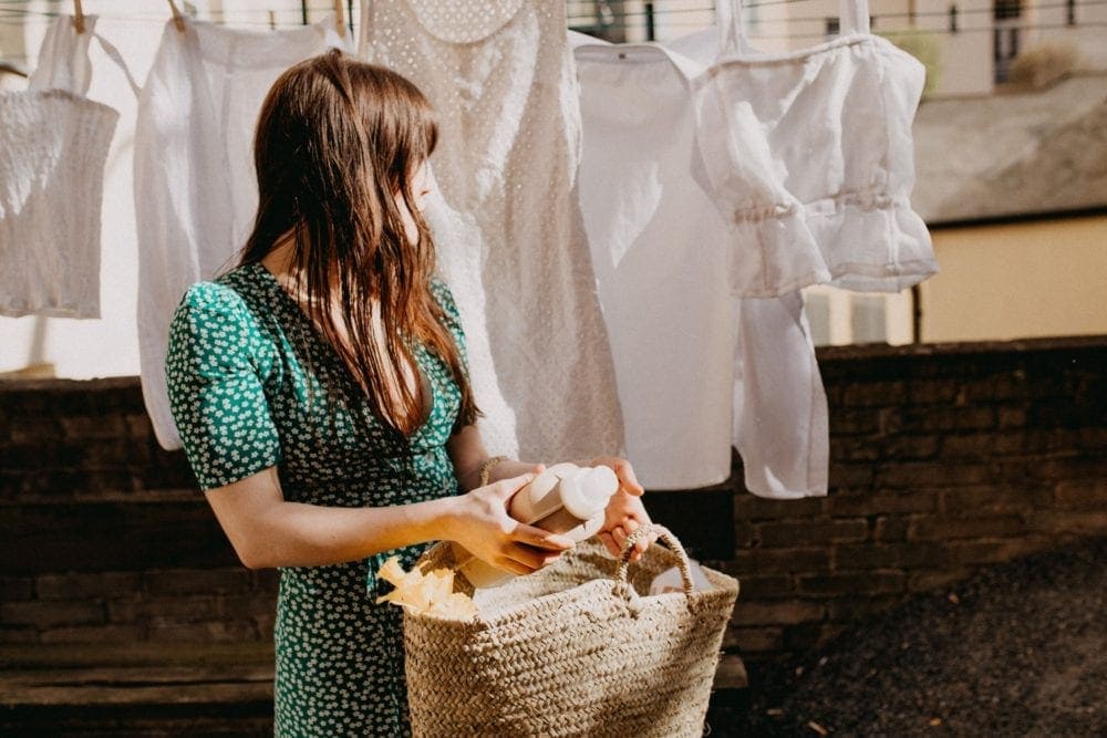 woman hanging clothes outside to dry