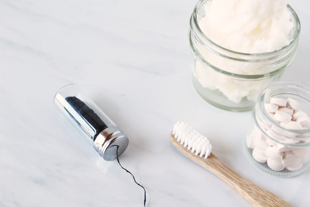 plastic free floss, bamboo toothbrush and toothpaste tablets