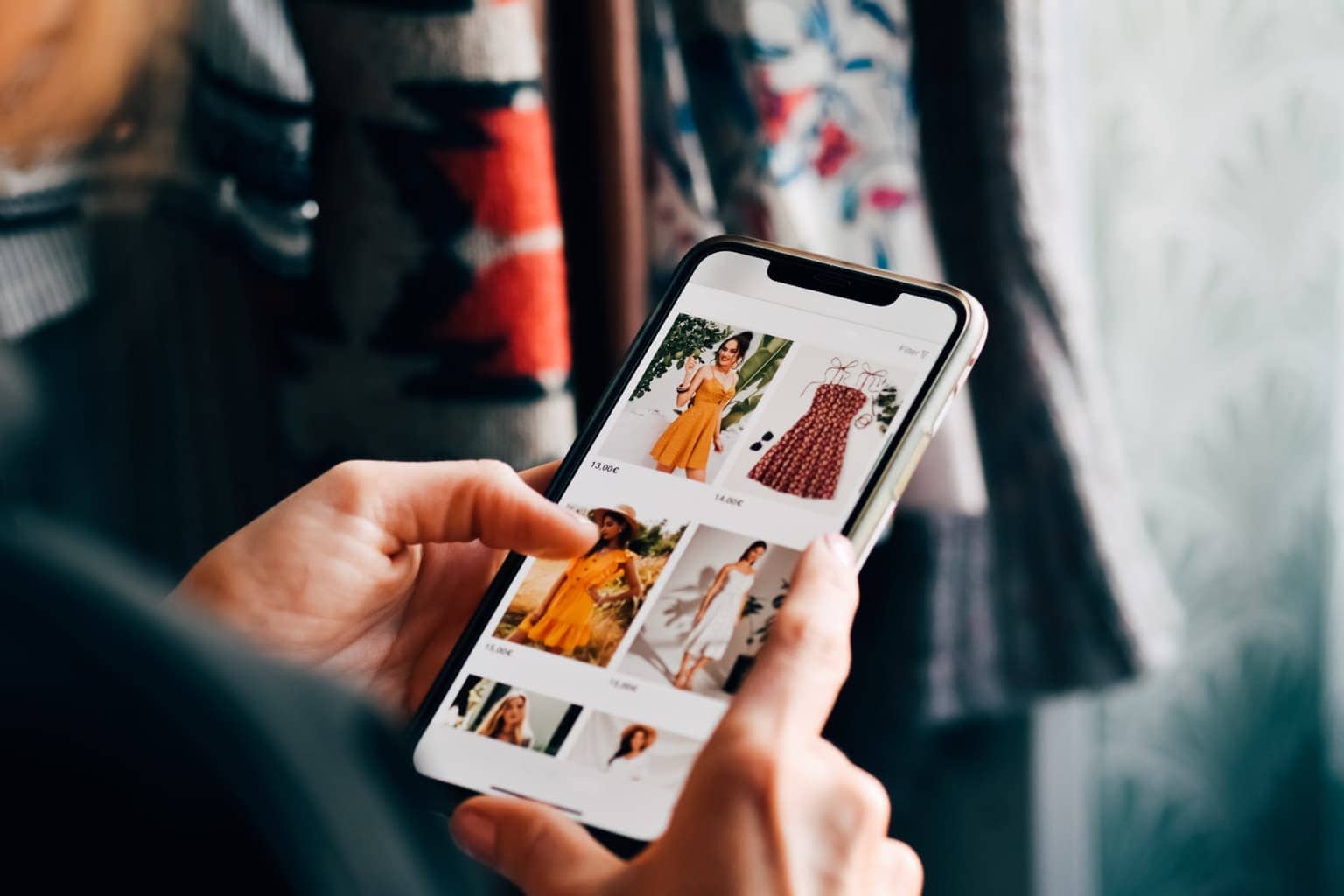 woman looking through listings on online thrift store website