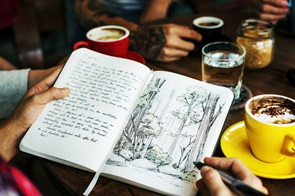 open journal with text and drawing 