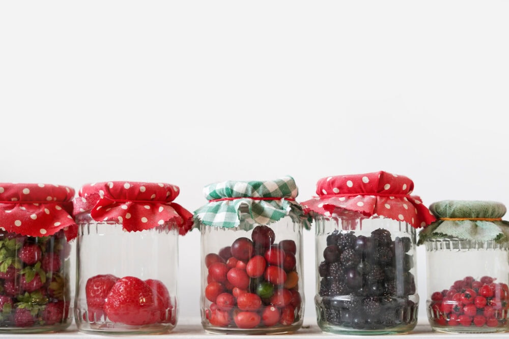 fruits in repurposed glass jars