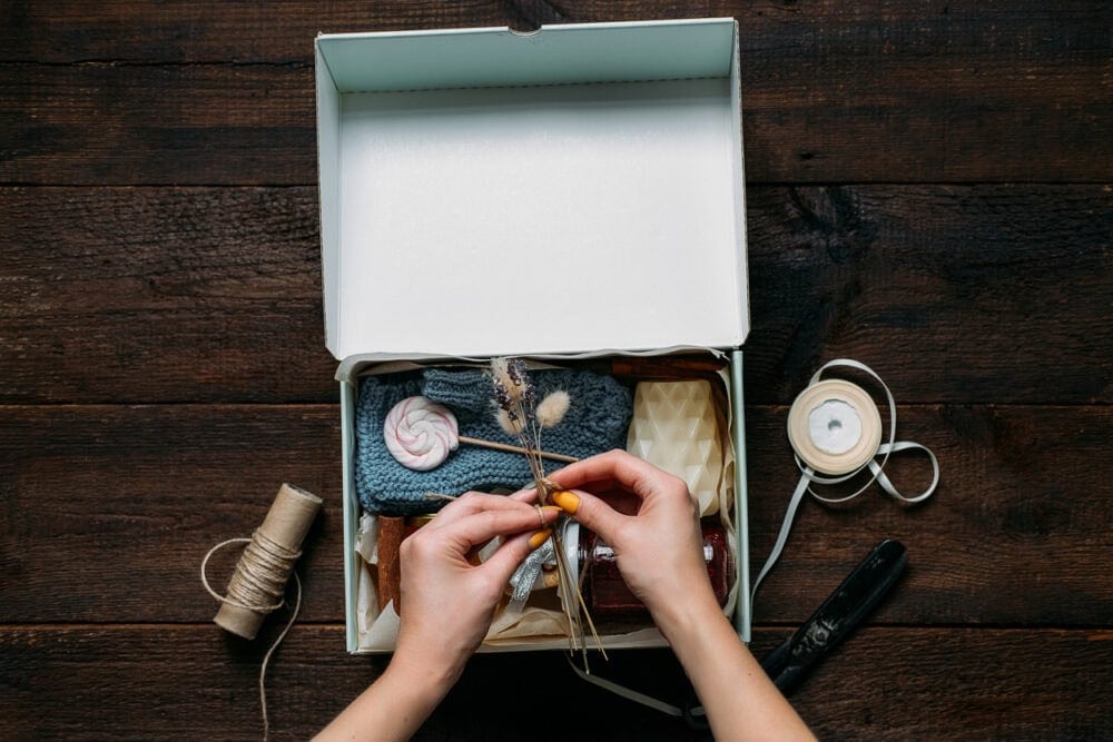 repurposed shoe box with items inside for storage