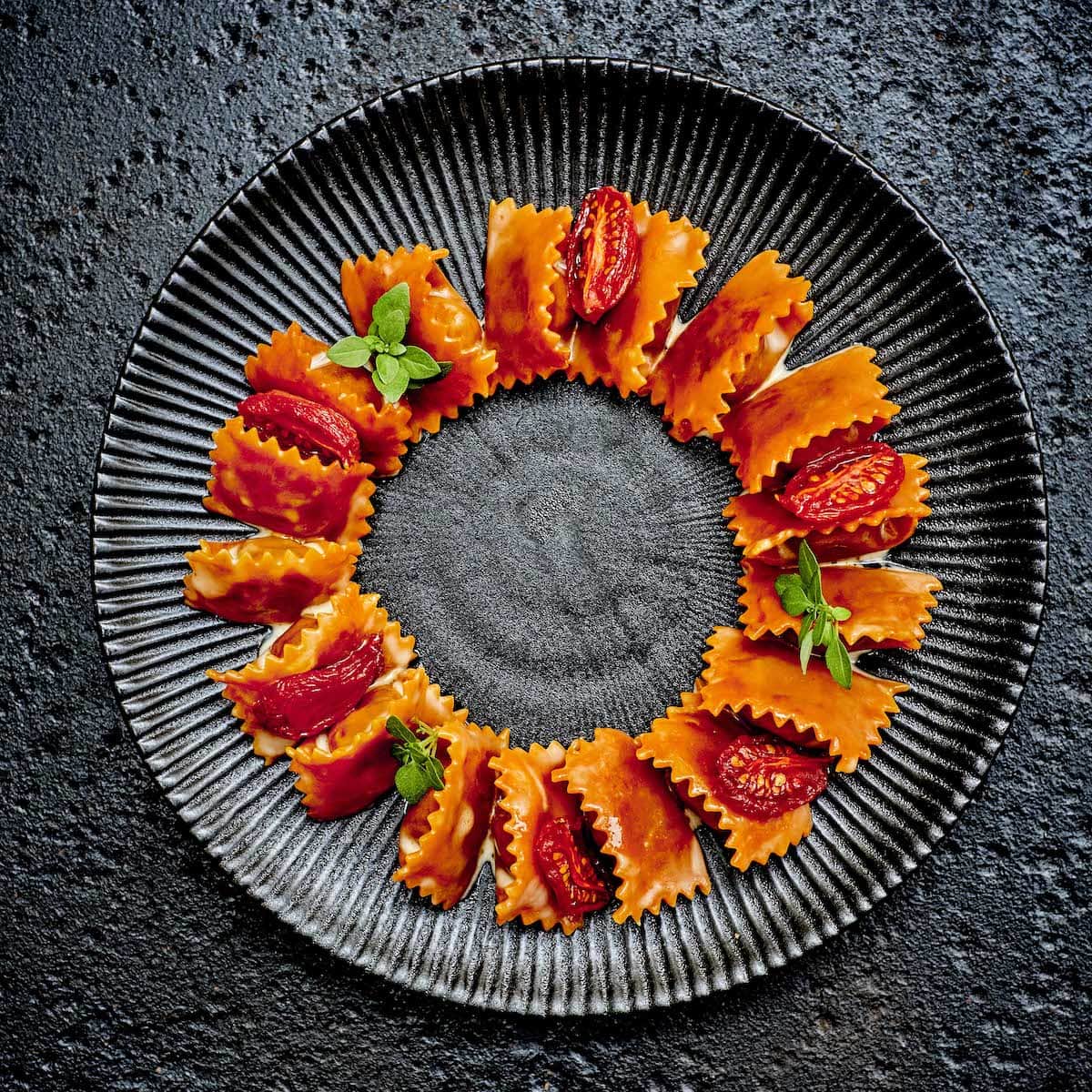 Raviolis del plin au confit de tomate