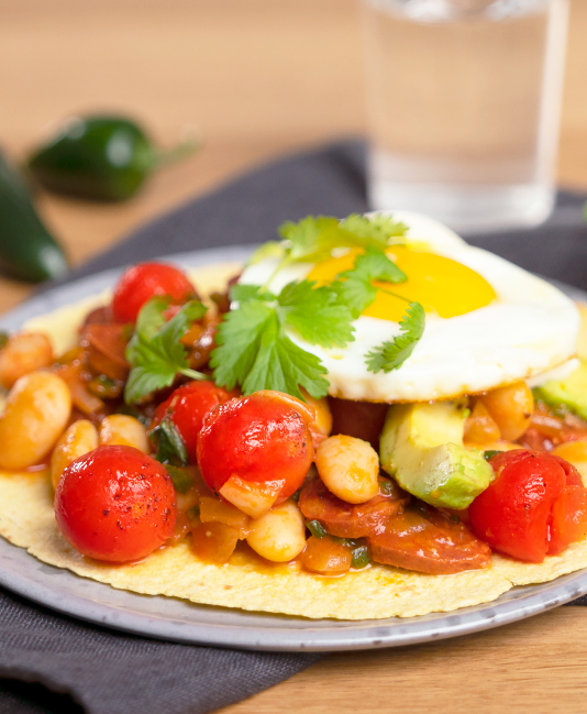 Huevos rancheros with cherry tomatoes