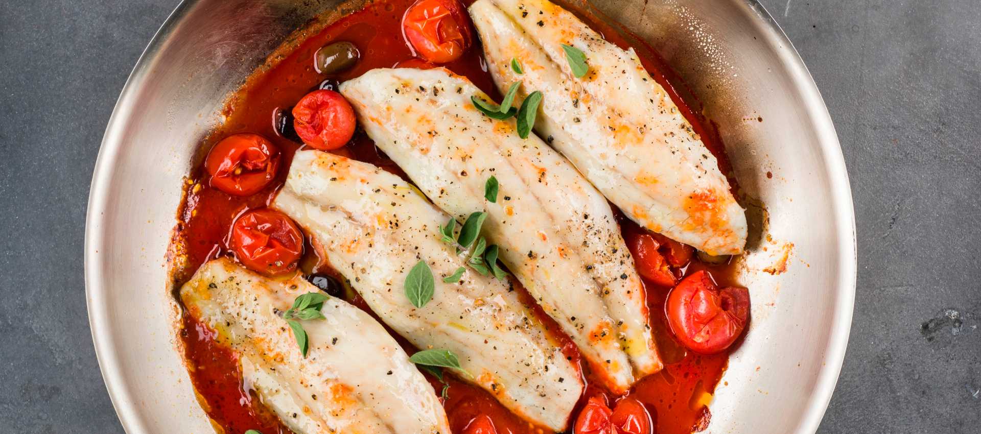 Branzino with cherry tomatoes and olives
