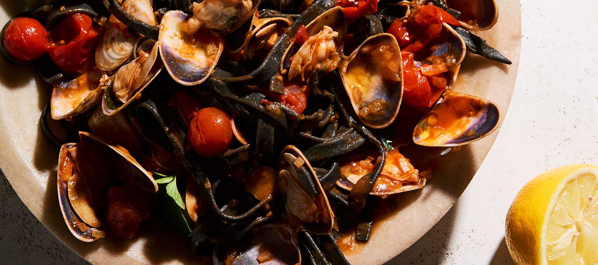 Squid ink pasta with cherry tomatoes
