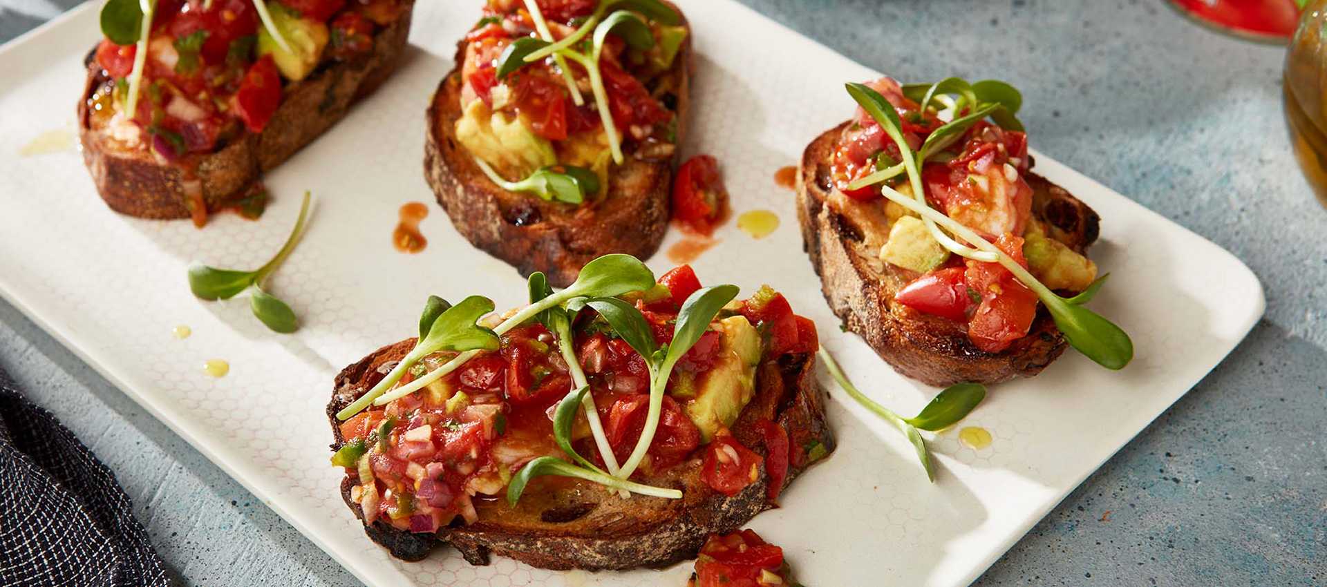 Shrimp and avocado toast with cherry tomato