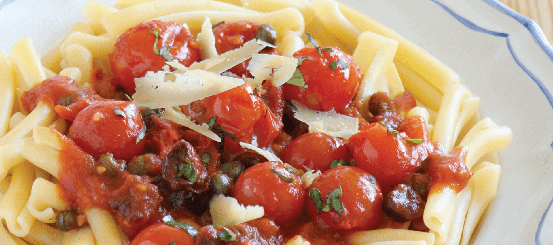 Pasta puttanesca with cherry tomatoes