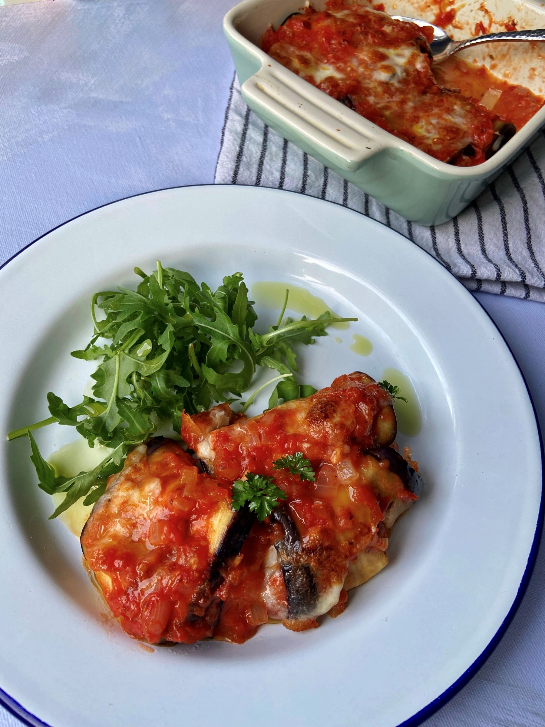 Aubergine roll with tomato, oil and basil