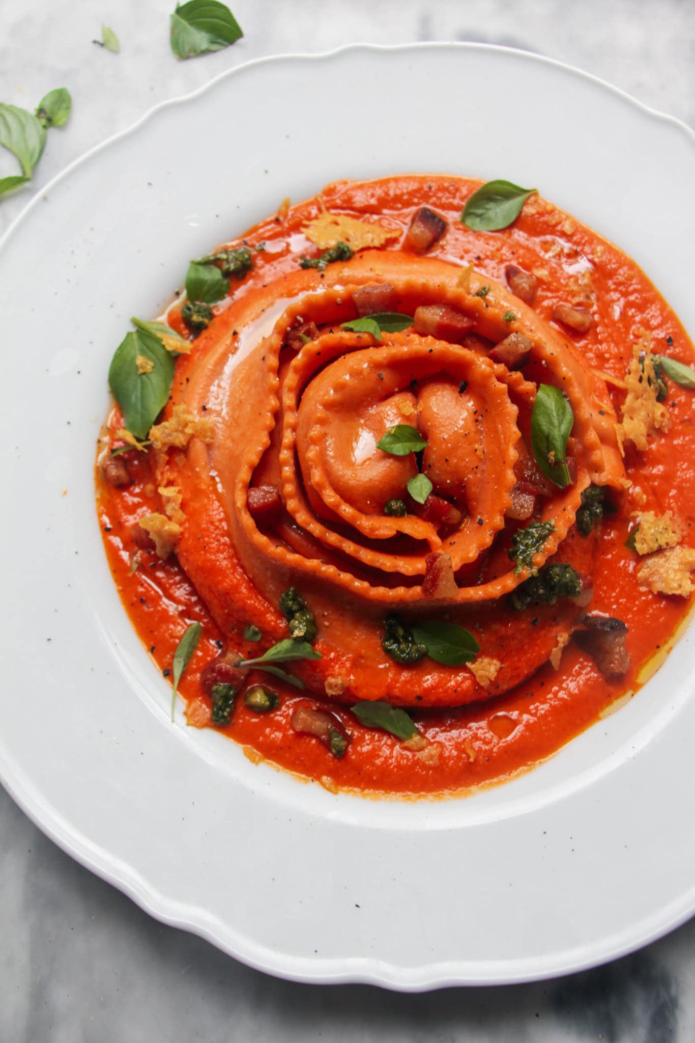Tomato, ricotta and guanciale stuffed girella pasta